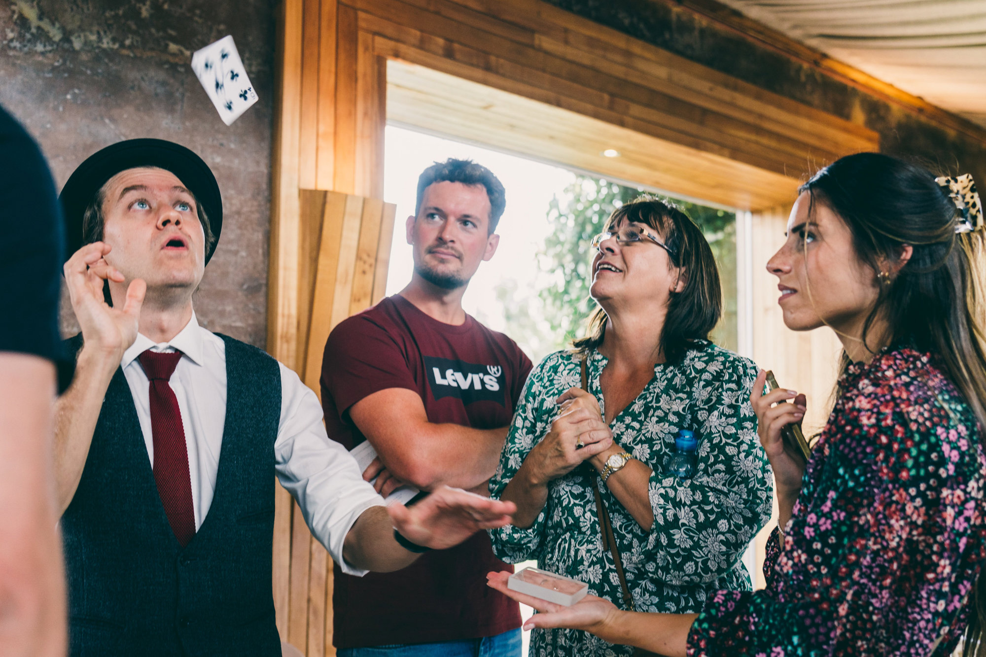 wedding magician amazing guests at wedding fair at elmore court in the cotswolds