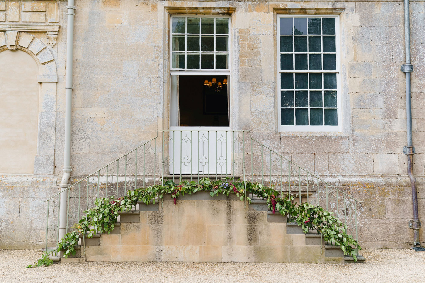 Wedding steps decorated with greenery at stately home elmore court