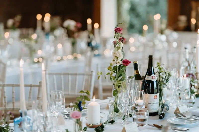 elegantly decorated white wedding reception tables
