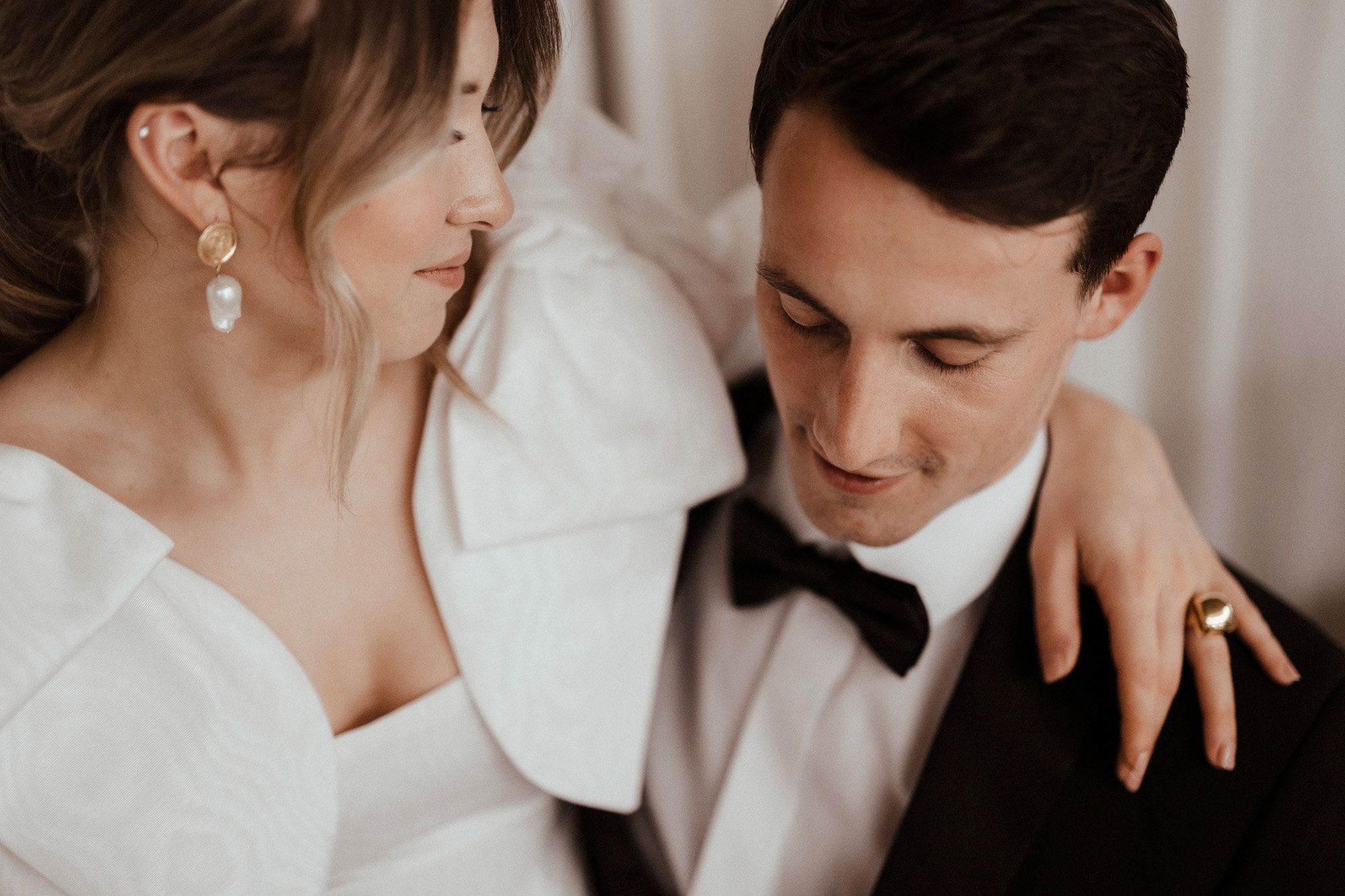 Pearls and Oversized bows wedding dress inspiration for luxe brides with moody aesthetic