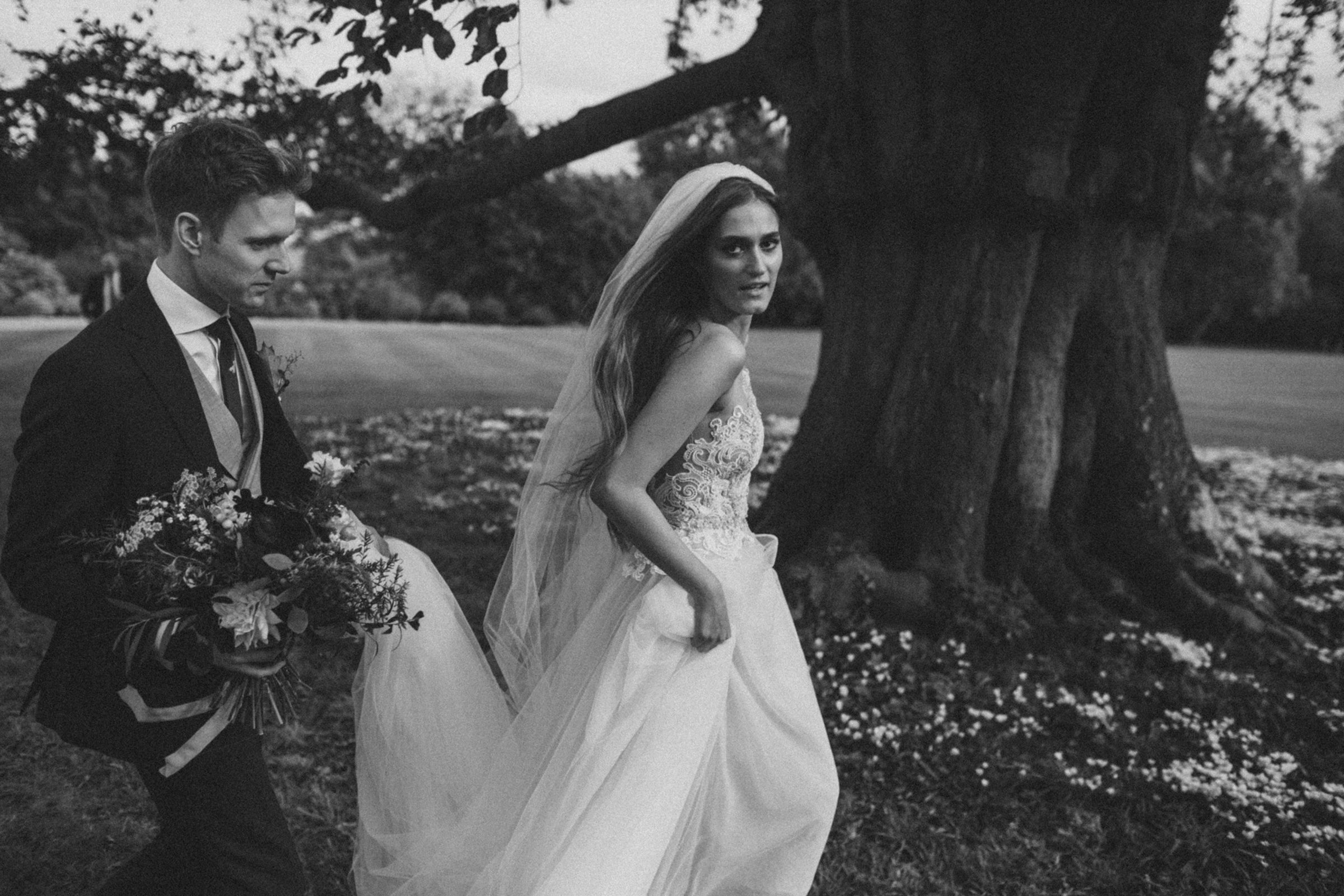 Modern romantic bride wearing Liz Martinez gown outside Elmore Court in the autumn