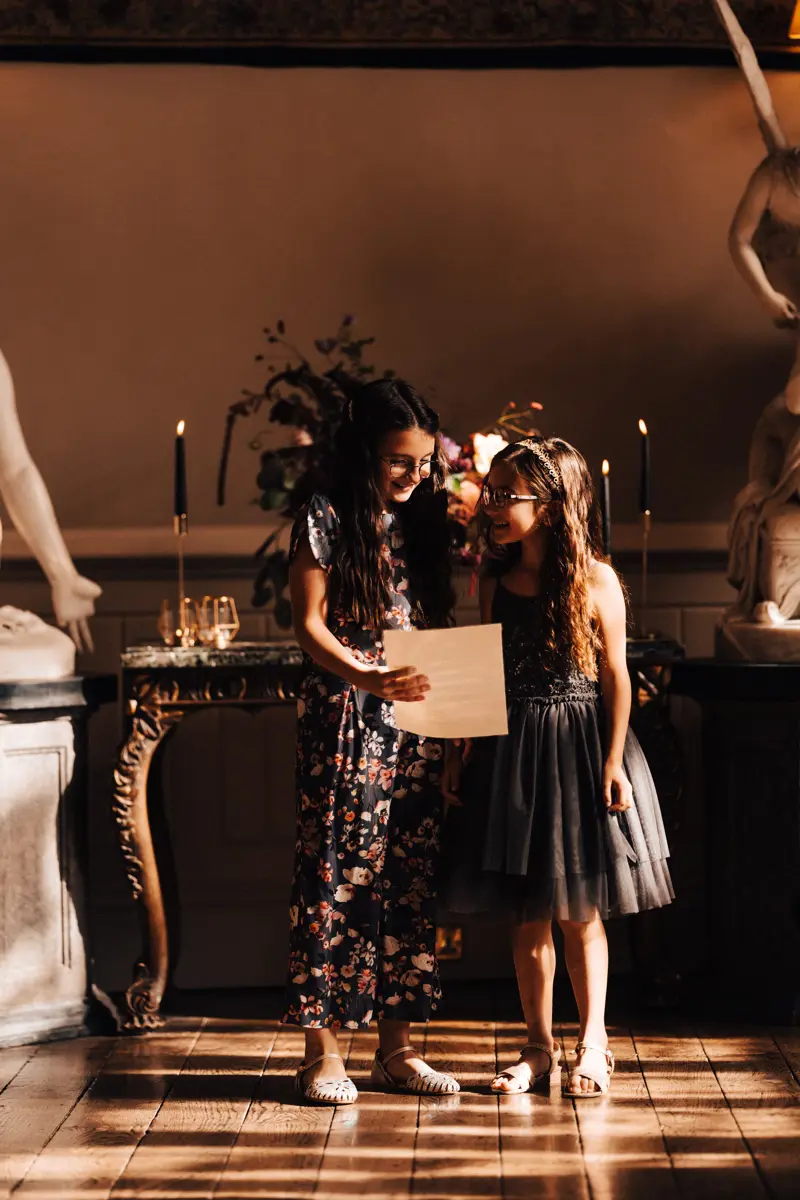Children taking part in readings during wedding ceremony at a stately home in gloucester
