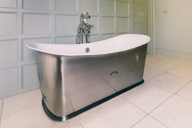 Freestanding silver bath in the huge ensuite bathroom of the smoking room bedroom