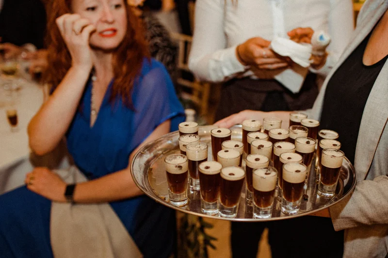 Espresso martini shots on a silver tray for a cool Autumn cocktail wedding in the Cotswolds