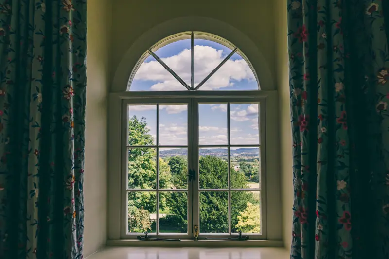 View of the cotswolds countryside from the window of the Time bedroom at wedding venue elmore court