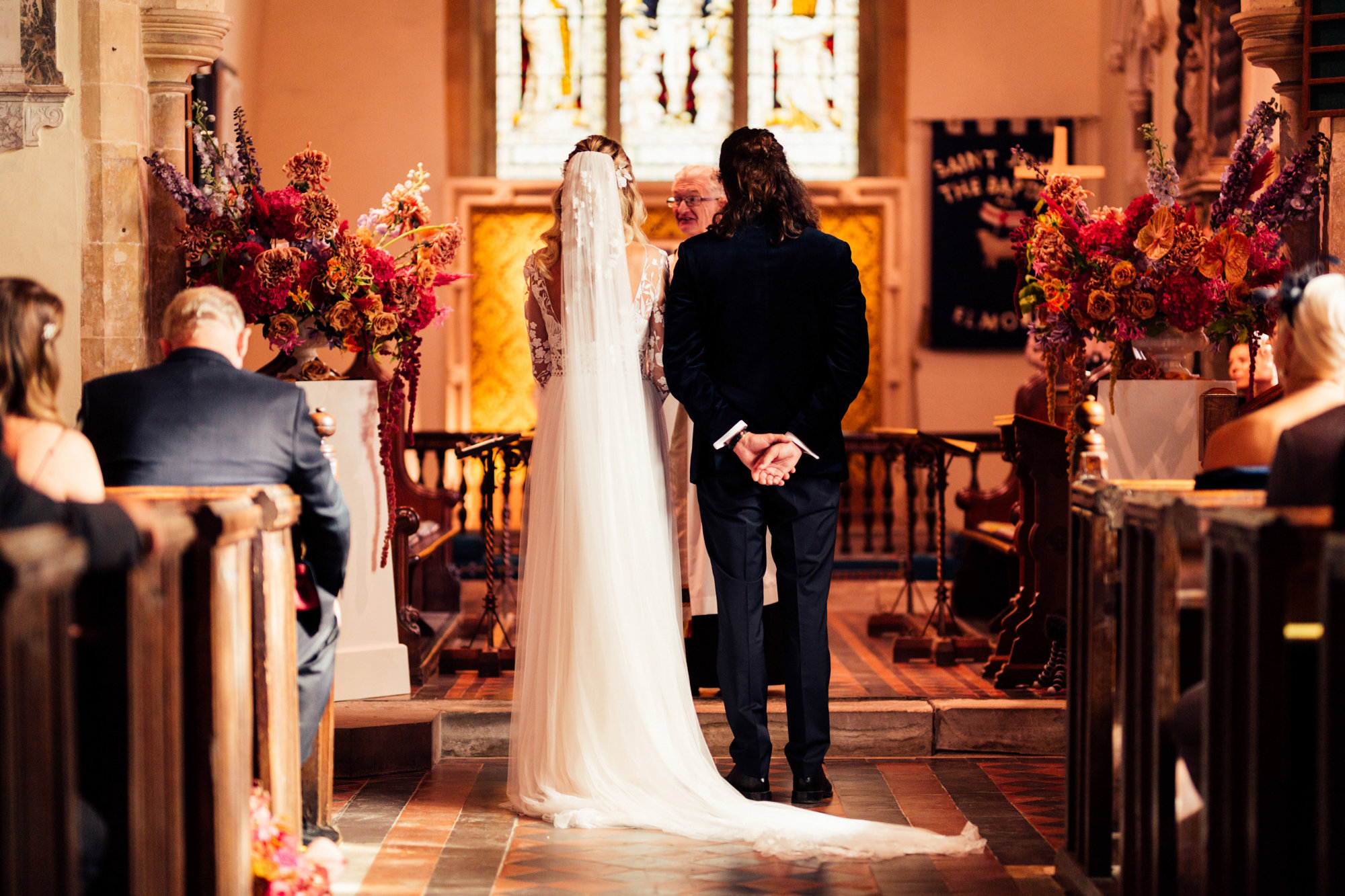 bride and groom in wedding ceremony at Elmore church known as the prettiest church in England to marry in the uk