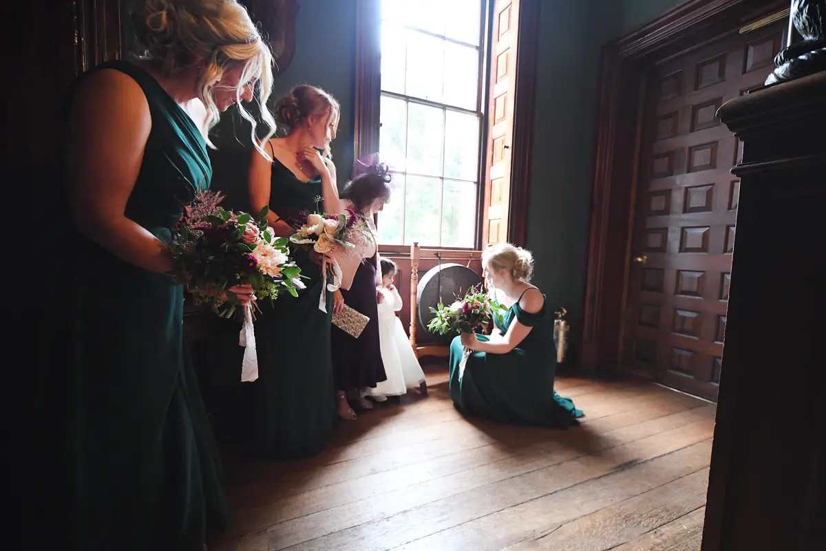 Autumn bridesmaids in green at stately home wedding venue for halloween wedding