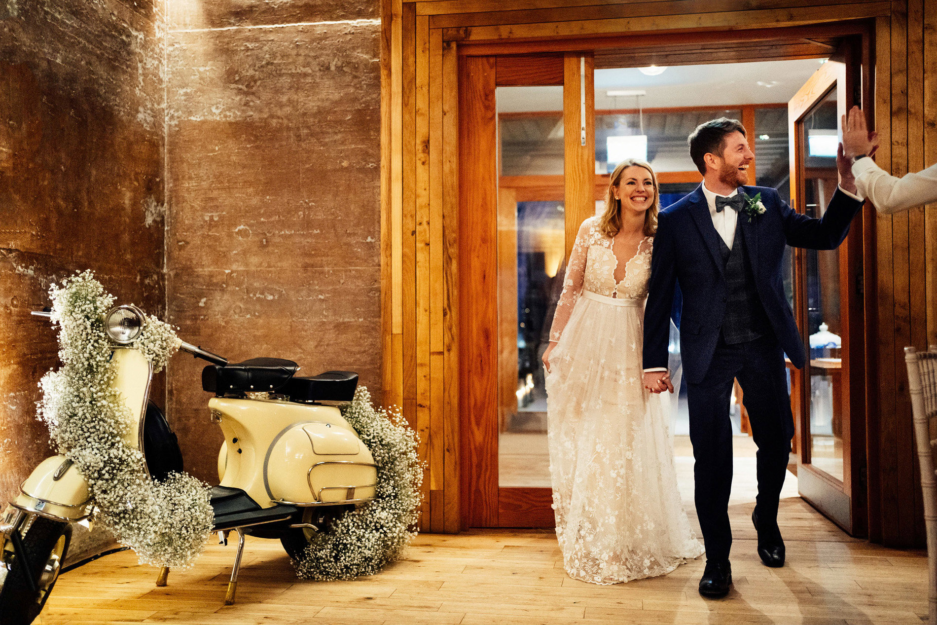 Bride and groom with vespa scooter