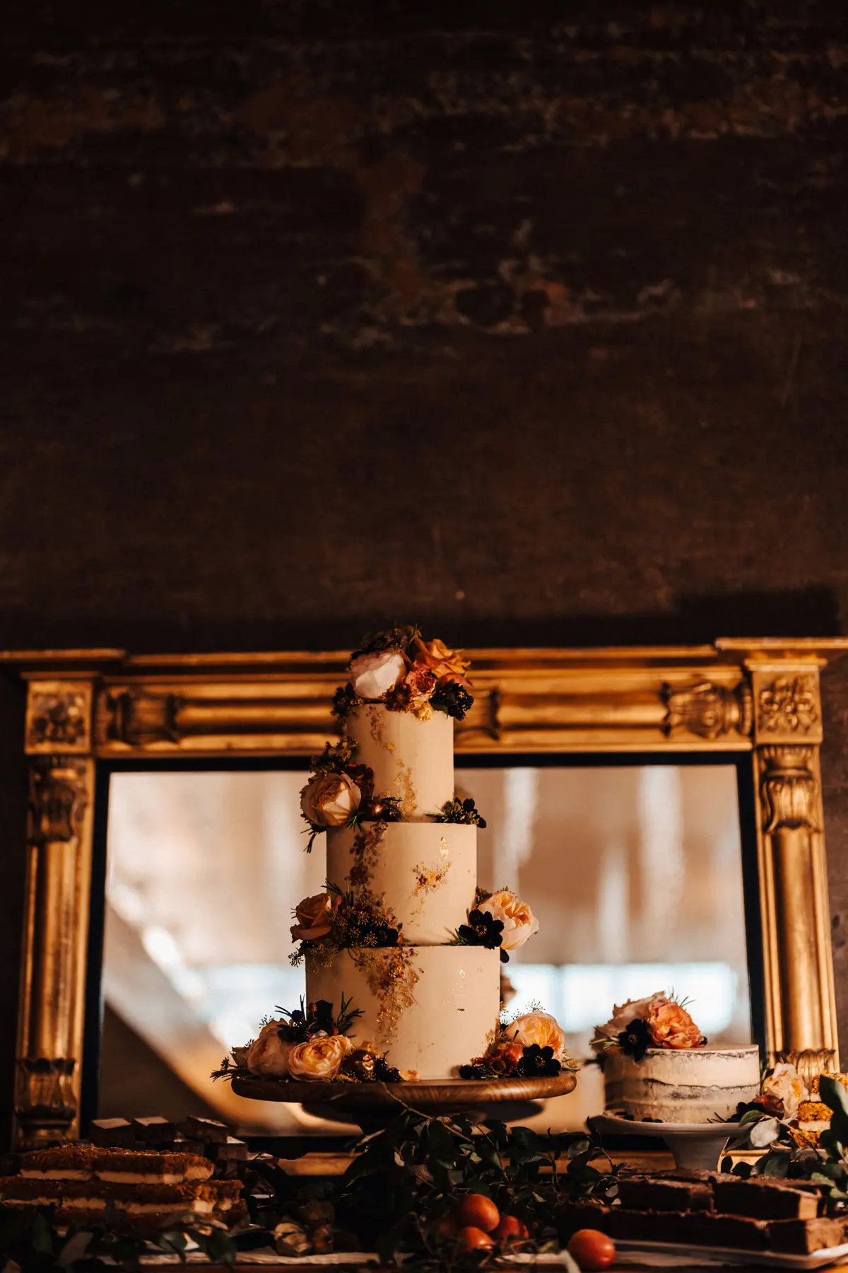 Wedding cake with real flowers for September wedding at sustainable wedding venue