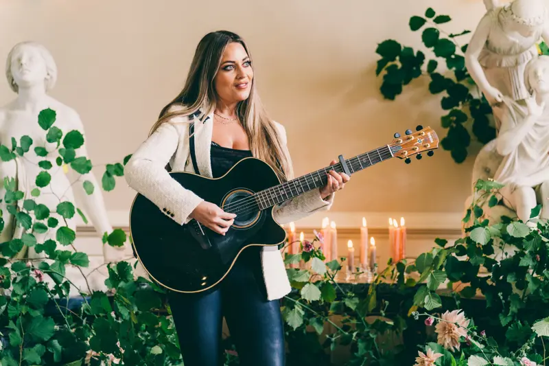 Abi Phillips singing at luxe wedding venue elmore court in Gloucestershire for a wild wedding fair