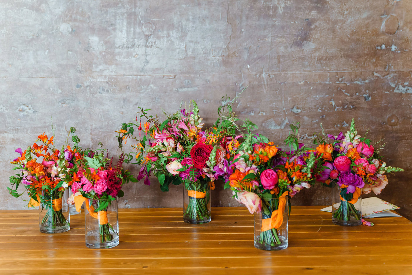 Brightly coloured summer wedding inspiration hot pink and orange bouquets