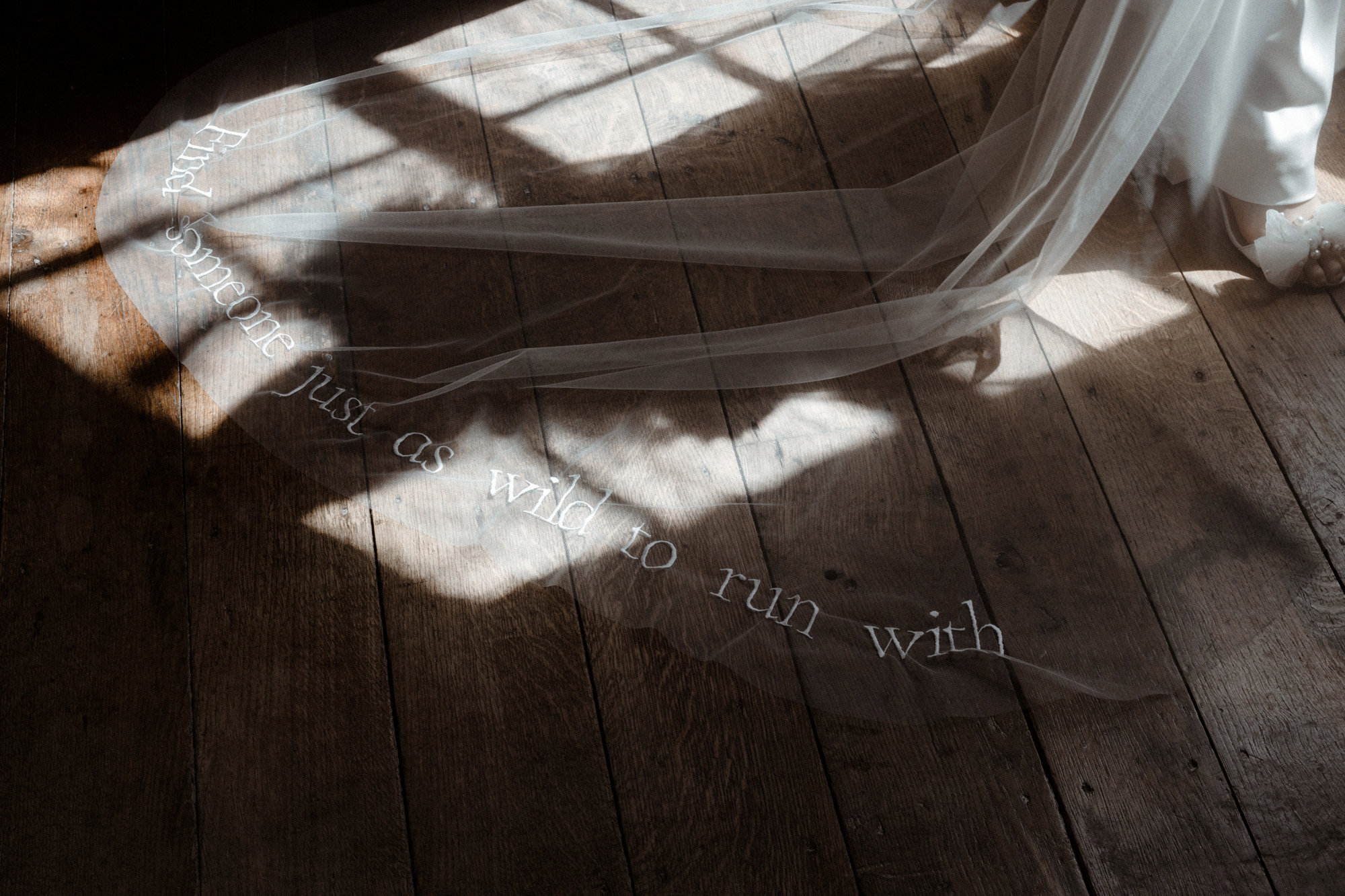 WIld wedding inspiration bridal wear for boho luxe wild brides. Veil embellished with the words 'find someone just as wild to run with'