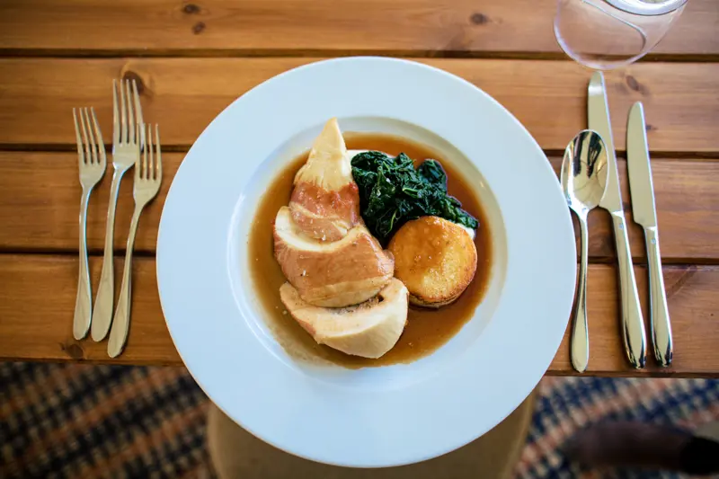 Chicken breast wrapped in parma ham, pork and cranberry stuffing, cavil nero, cauliflower puree, fondant potato and madeira jus from our winter menu