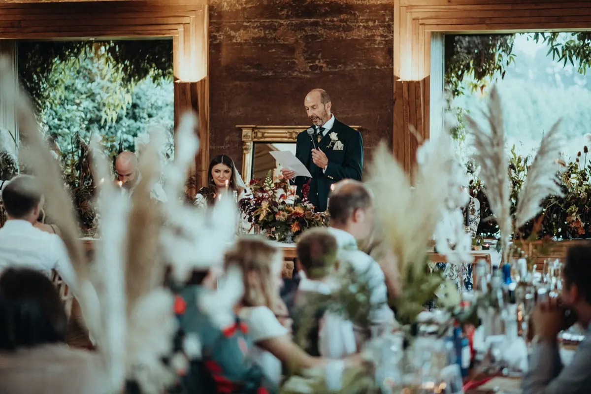 Rustic romantic wedding reception in rammed earth eco venue