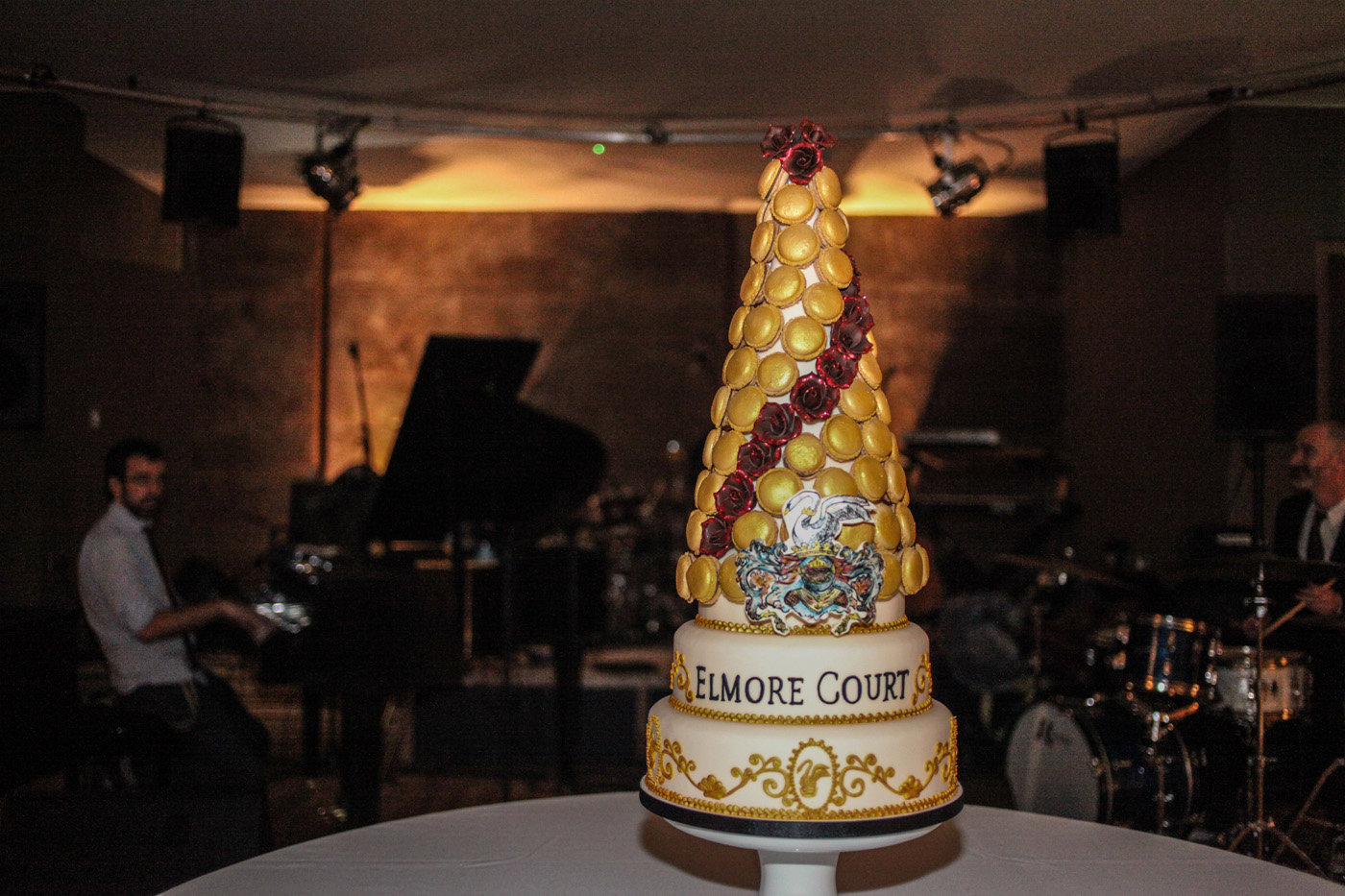Macaroon tower cake with elmore court written in icing for big party