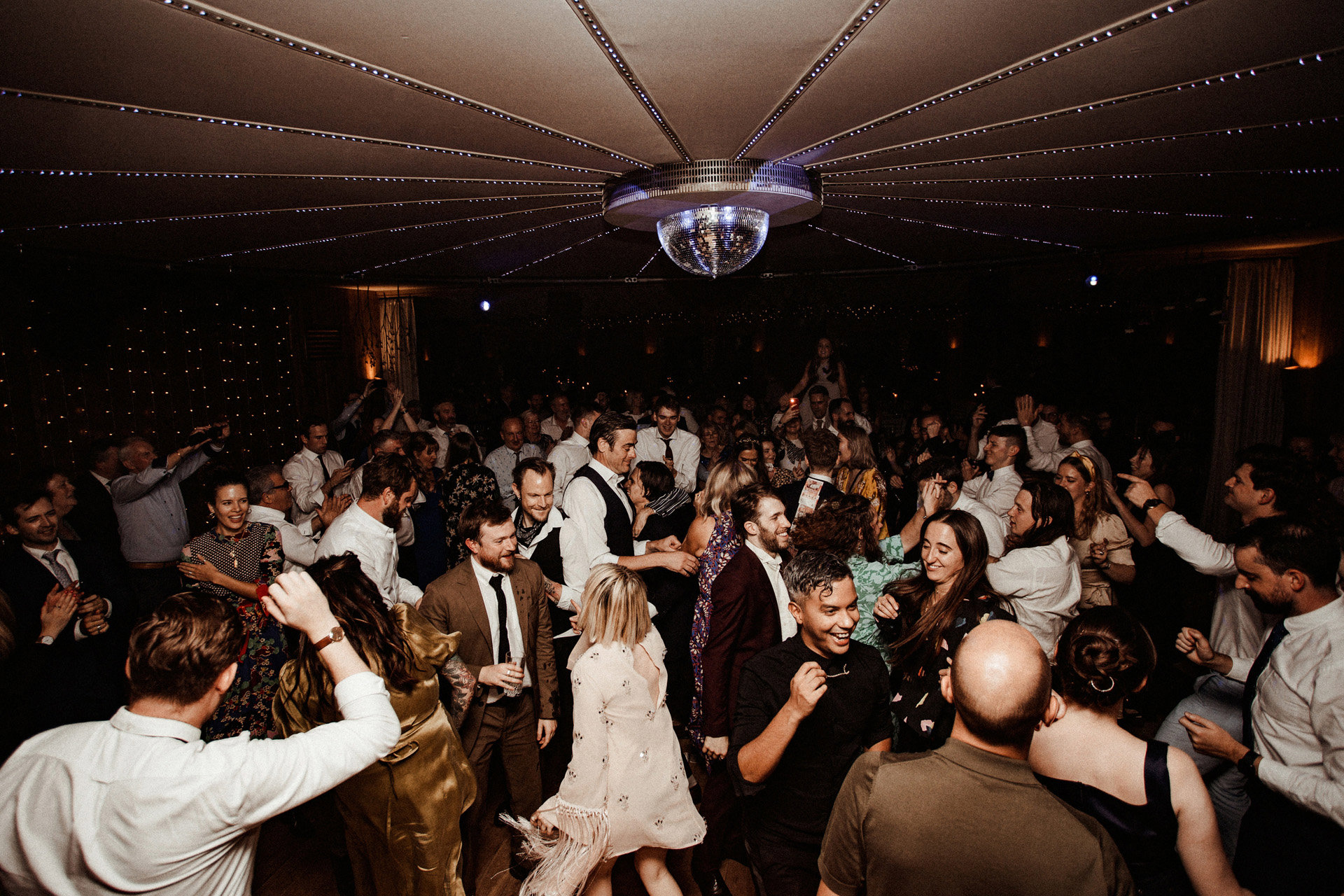 Late night wedding party guests having an amazing dance at soundproof party venue in Gloucestershire