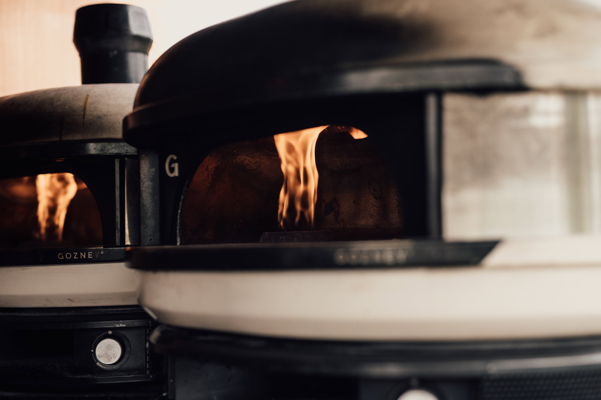 Wedding pizza from a cool truck with light up sign at wedding fair in the cotswolds