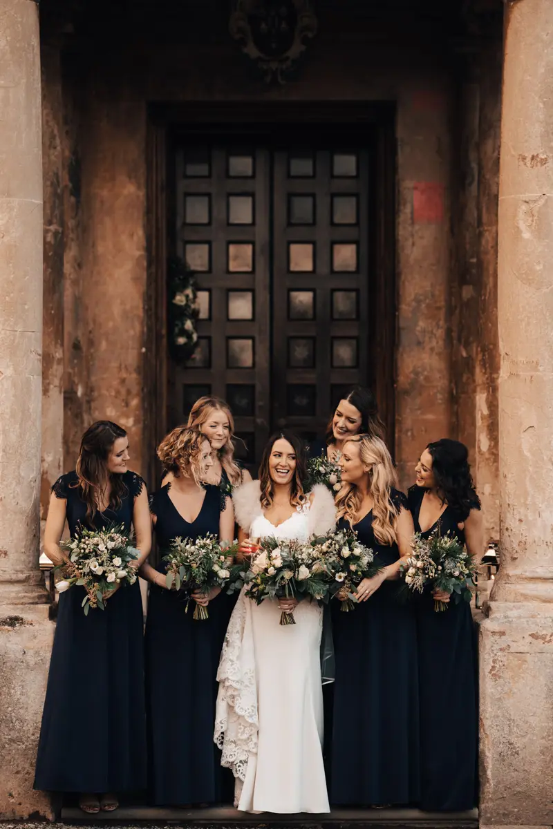 Black bridesmaids dresses at an autumn wedding at elmore court