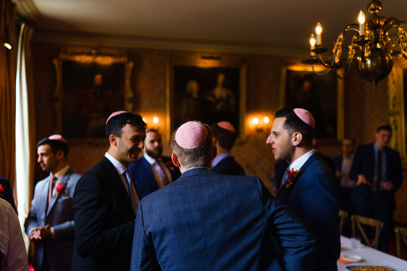 Jewish men in kippot at tish ceremony