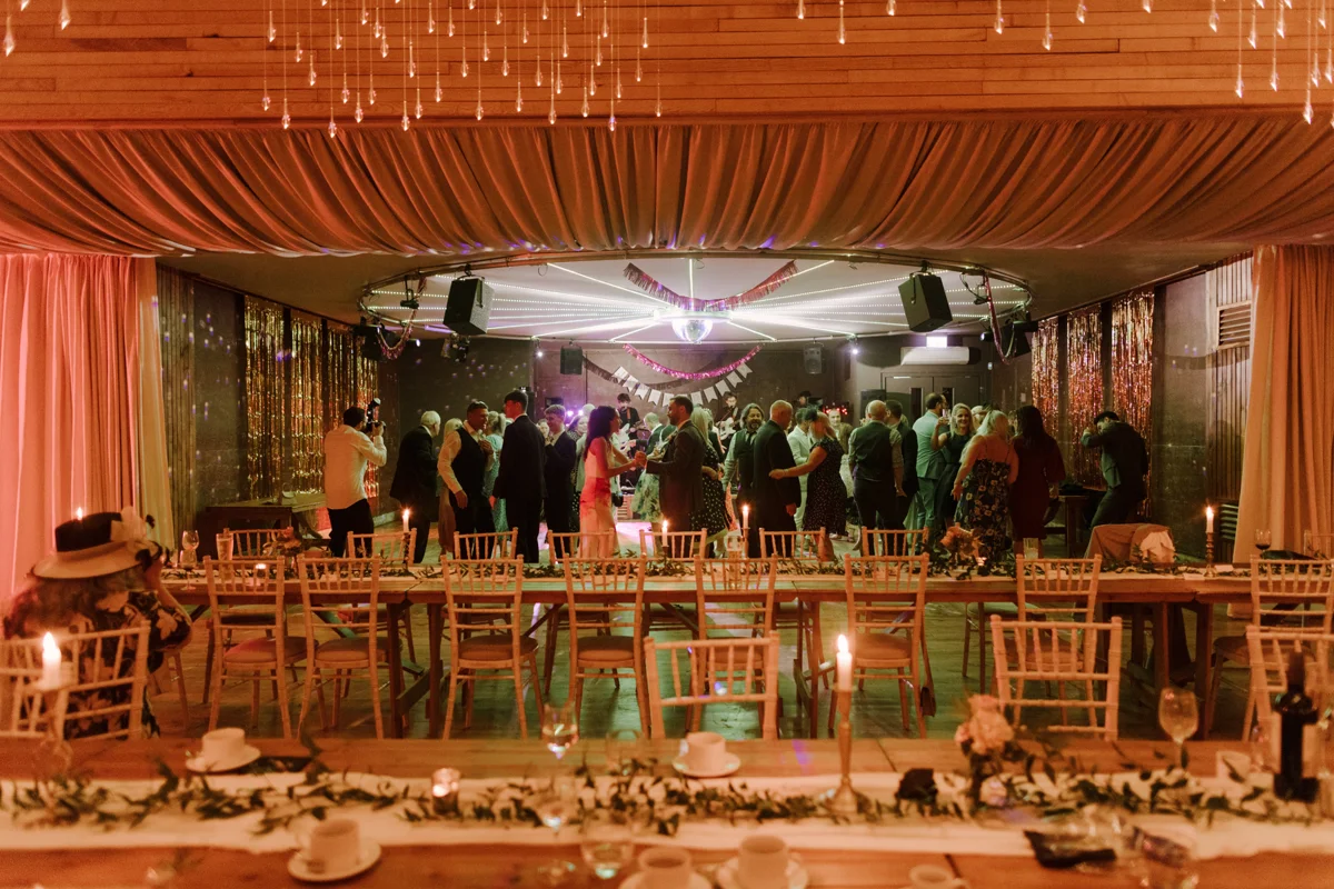 Party wedding venue with cool lighting and guests dancing and having fun with funktion one soundsystem