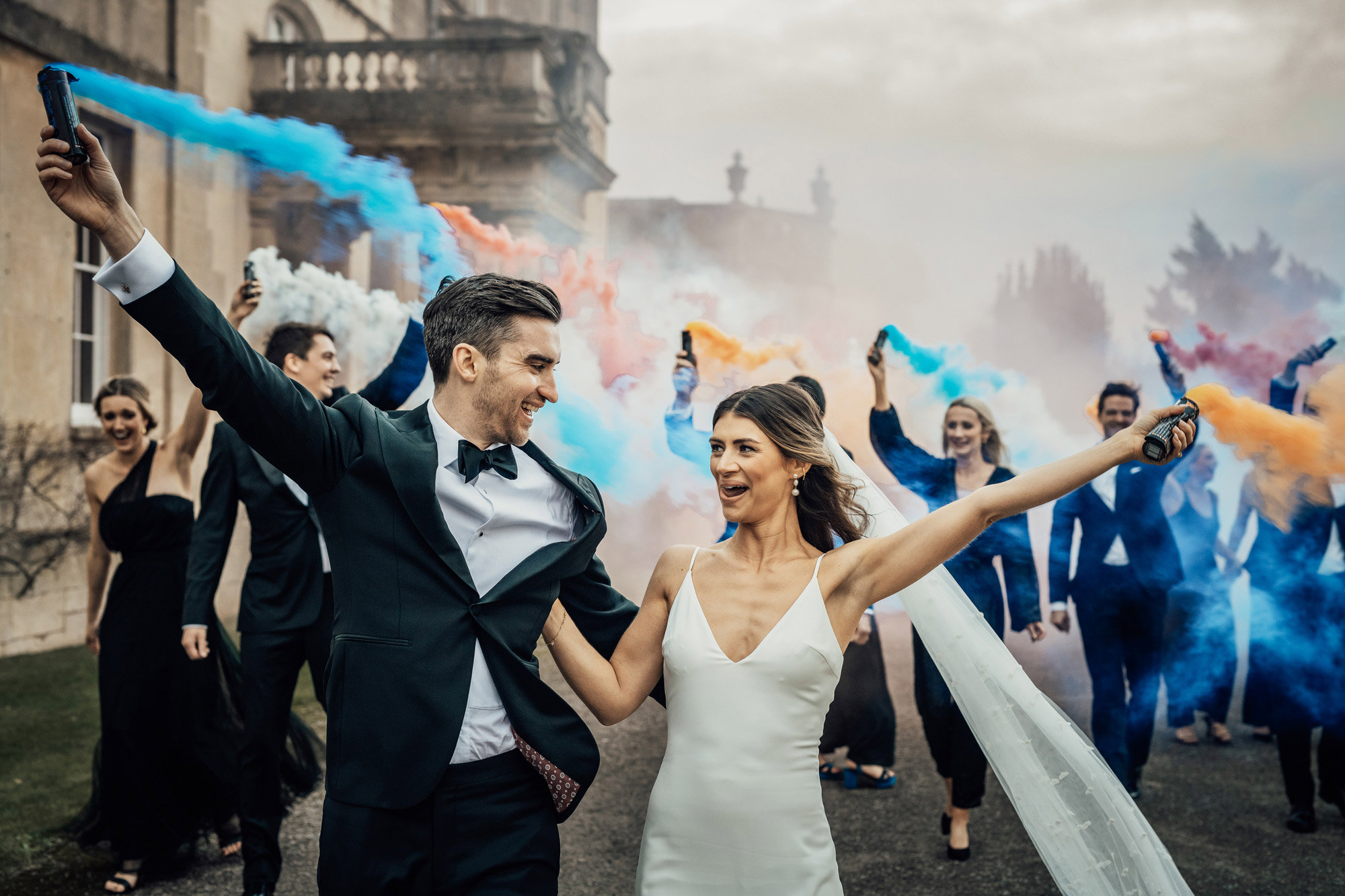 cool bride and groom Smoke bomb photoshoot for a black tie christmas wedding