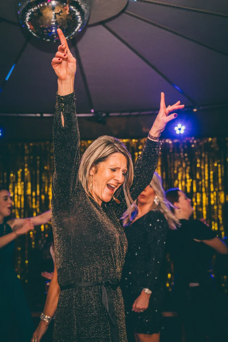 Team E flock to the dance floor for their studio 54 themed party