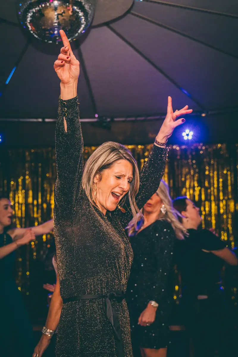 Team E flock to the dance floor for their studio 54 themed party