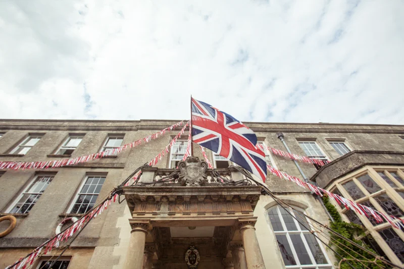 union jack bunting and english flag for a jubilee inspired wedding in manor house elmore court in the cotswolds