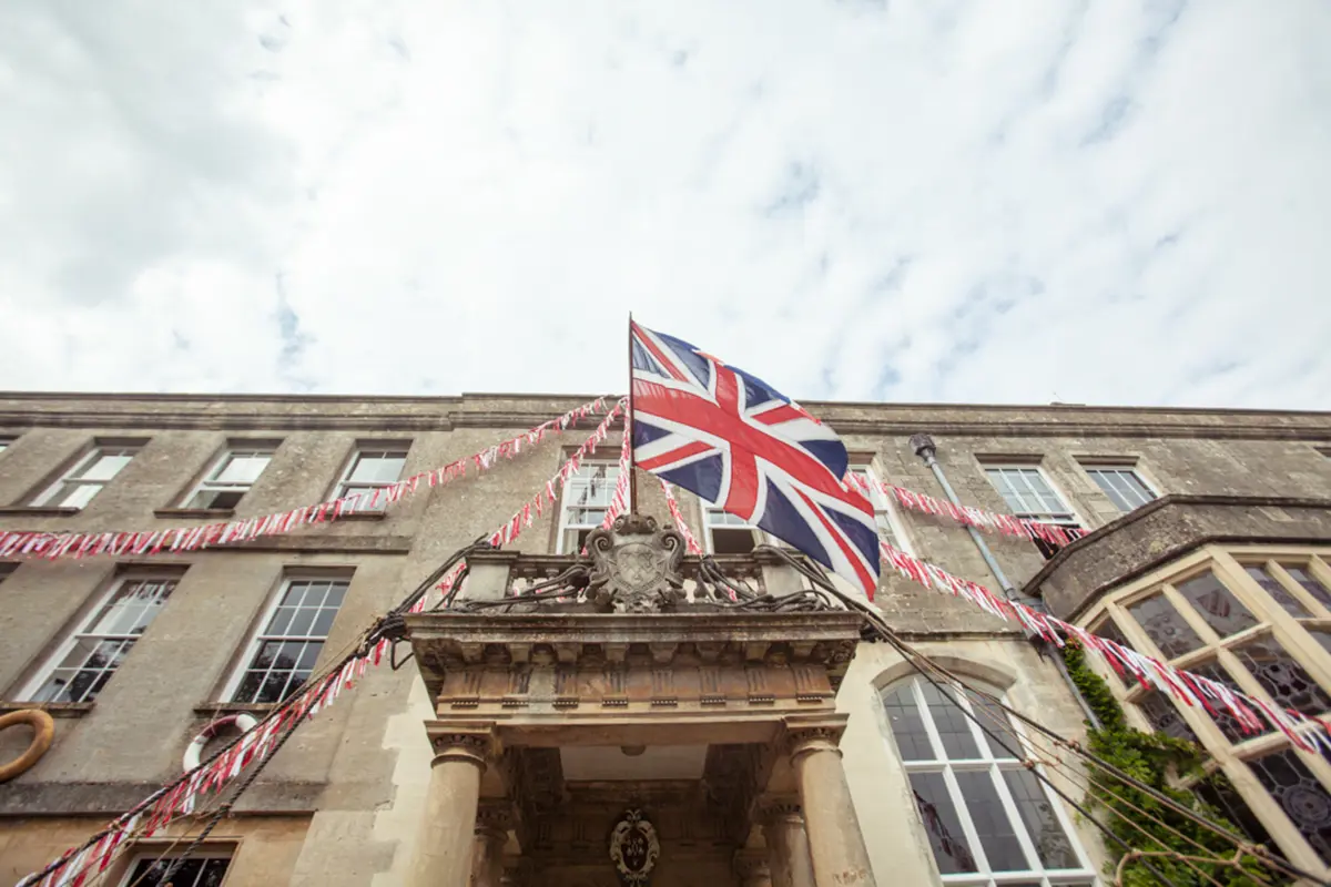 union jack bunting and english flag for a jubilee inspired wedding in manor house elmore court in the cotswolds