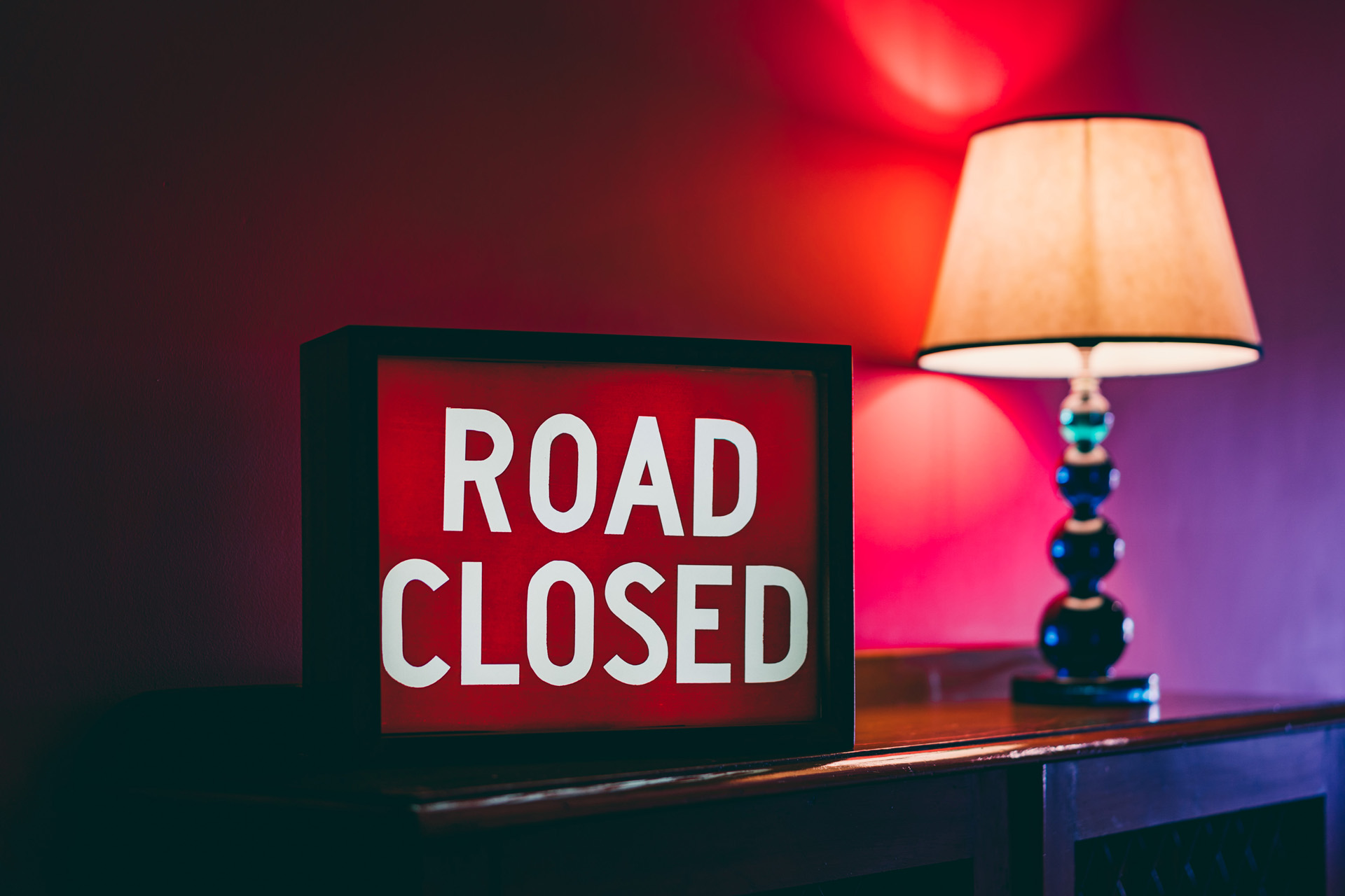 Road closed sign in the pink corridor of unusual wedding venue elmore court