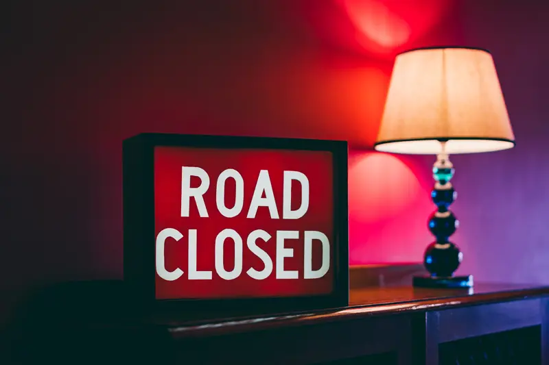 Road closed sign in the pink corridor of unusual wedding venue elmore court