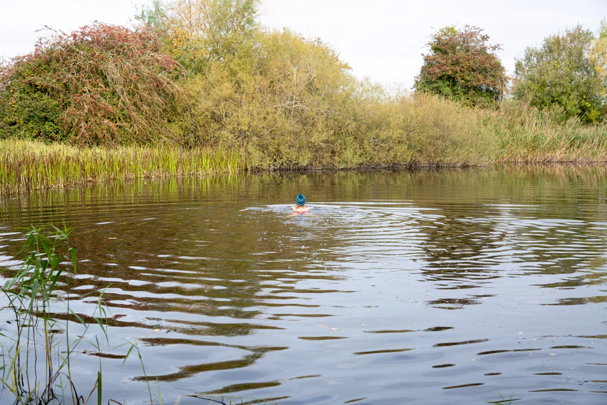 Wild swimming at a secret spot in the cotswolds at rewilded wedding venue elmore court