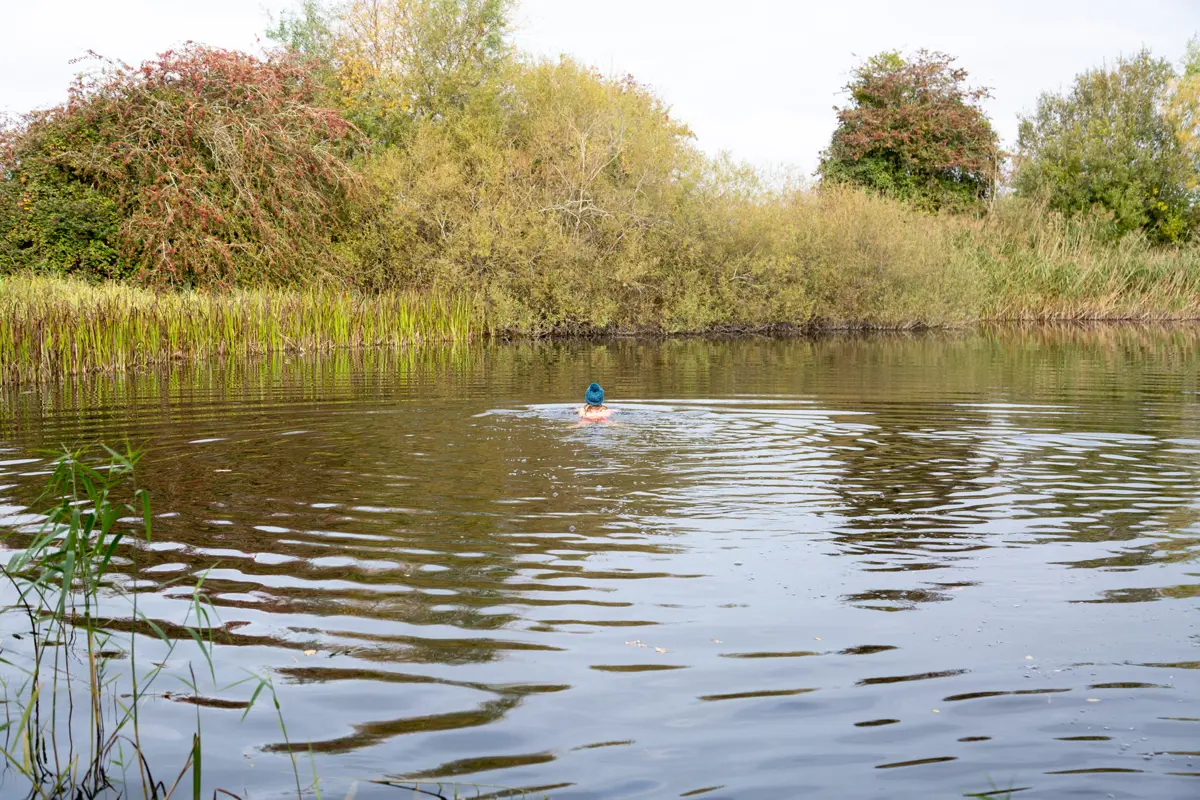 Wild swimming at a secret spot in the cotswolds at rewilded wedding venue elmore court