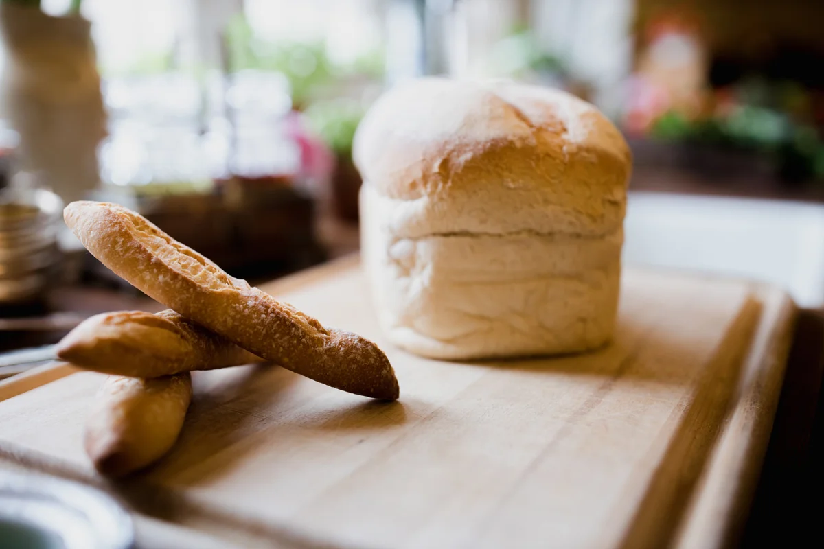 Freshly baked bread, french sticks and white loaf ready for post wedding breakfasts to soak up hangovers at Elmore Court