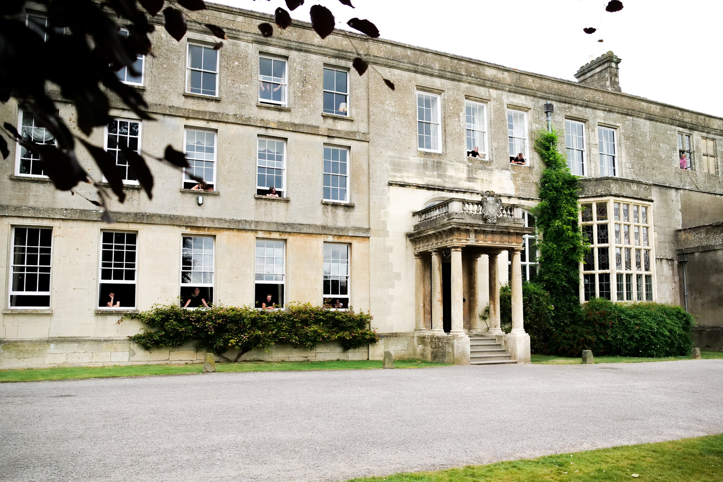 Elmore court mansion house with all the housekeepers looking out of the bedroom windows
