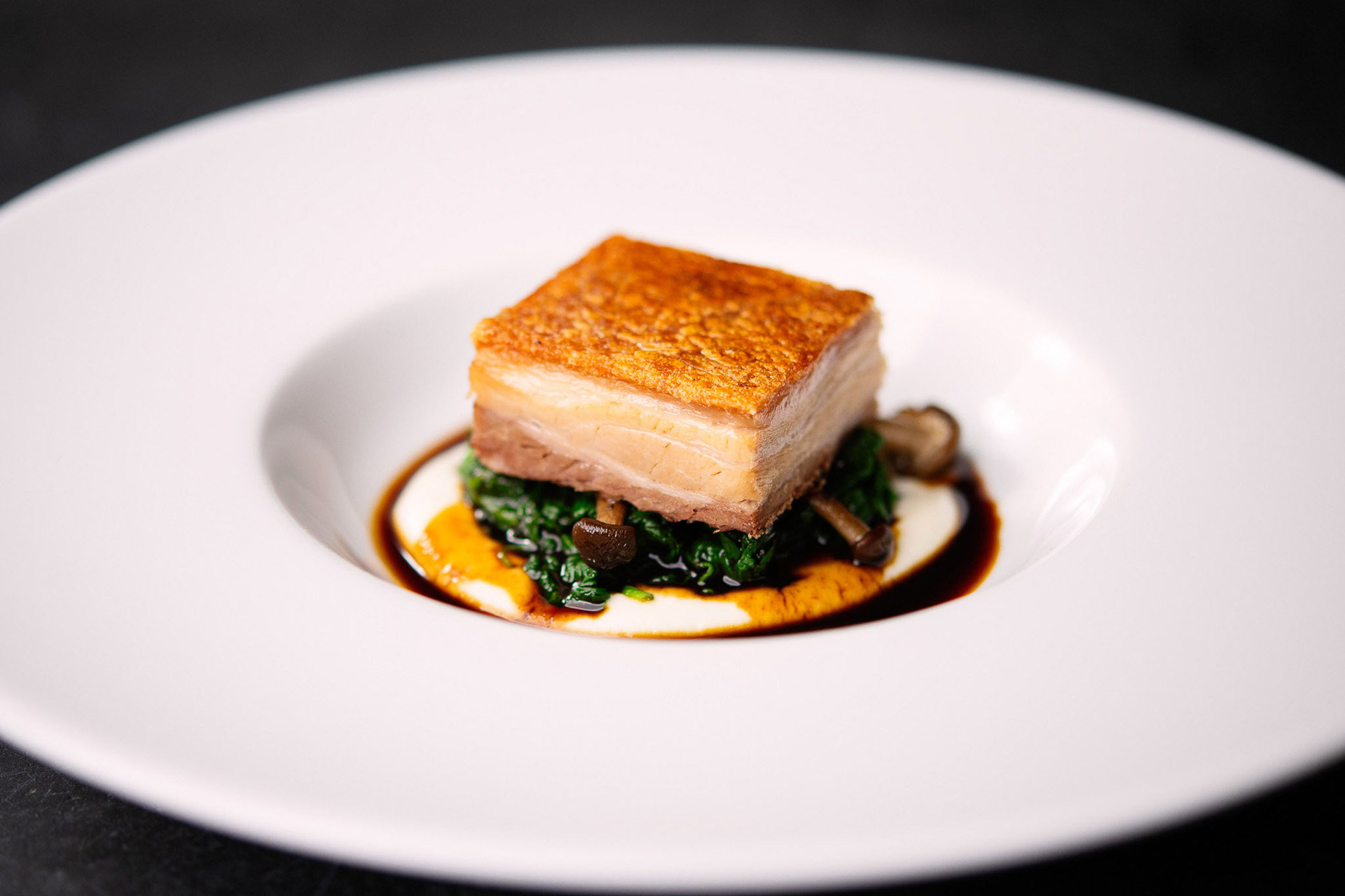 Wedding menus at Elmore Court. Slow roast pork belly, celeriac pure, wild mushrooms, spinach, red wine sauce