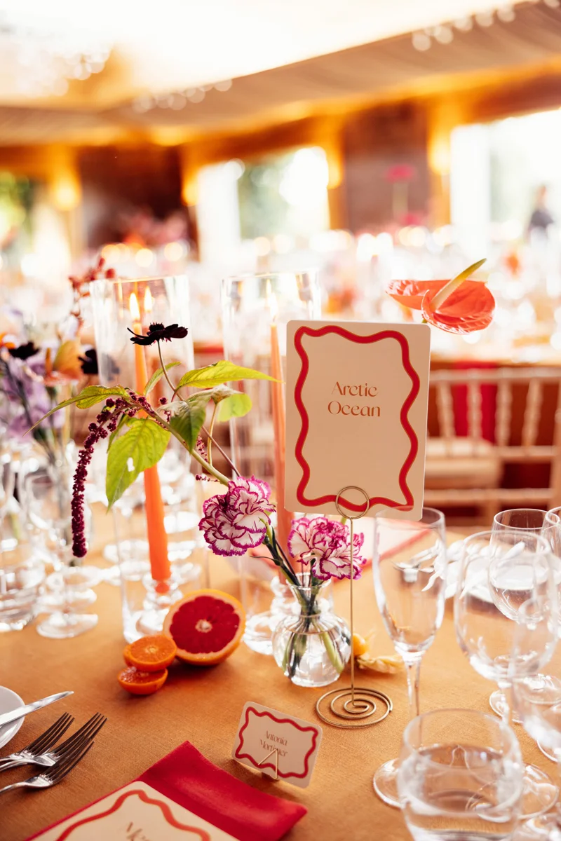 Colourful wedding reception decor and retro stationery for party wedding in Gloucester