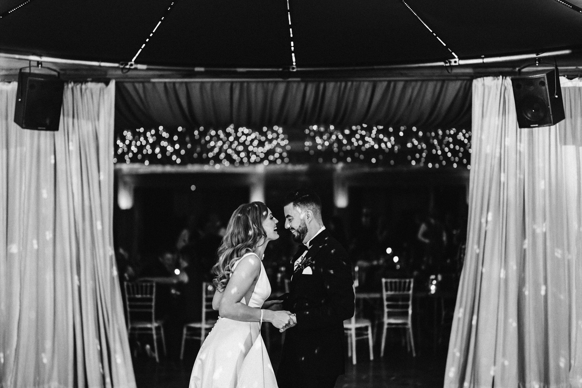 starry night vibes for this rockstar couples first dance at soundproof eco wedding reception venue in the gloucestershire countryside