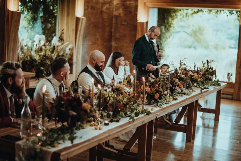speeches at reception with rustic decor