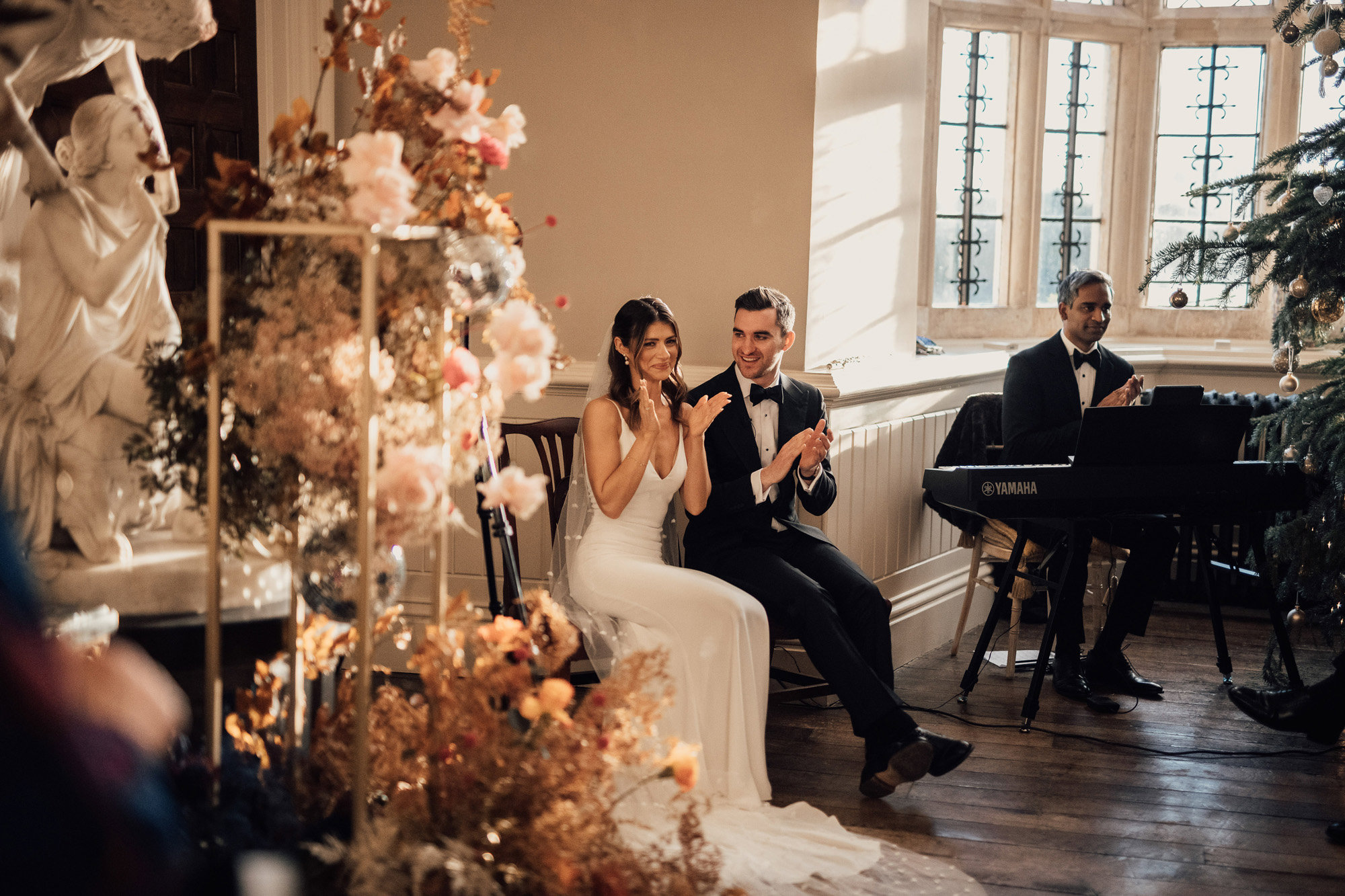 Luxe wedding flowers for a black tie christmas wedding ceremony in a stately home in the cotswolds