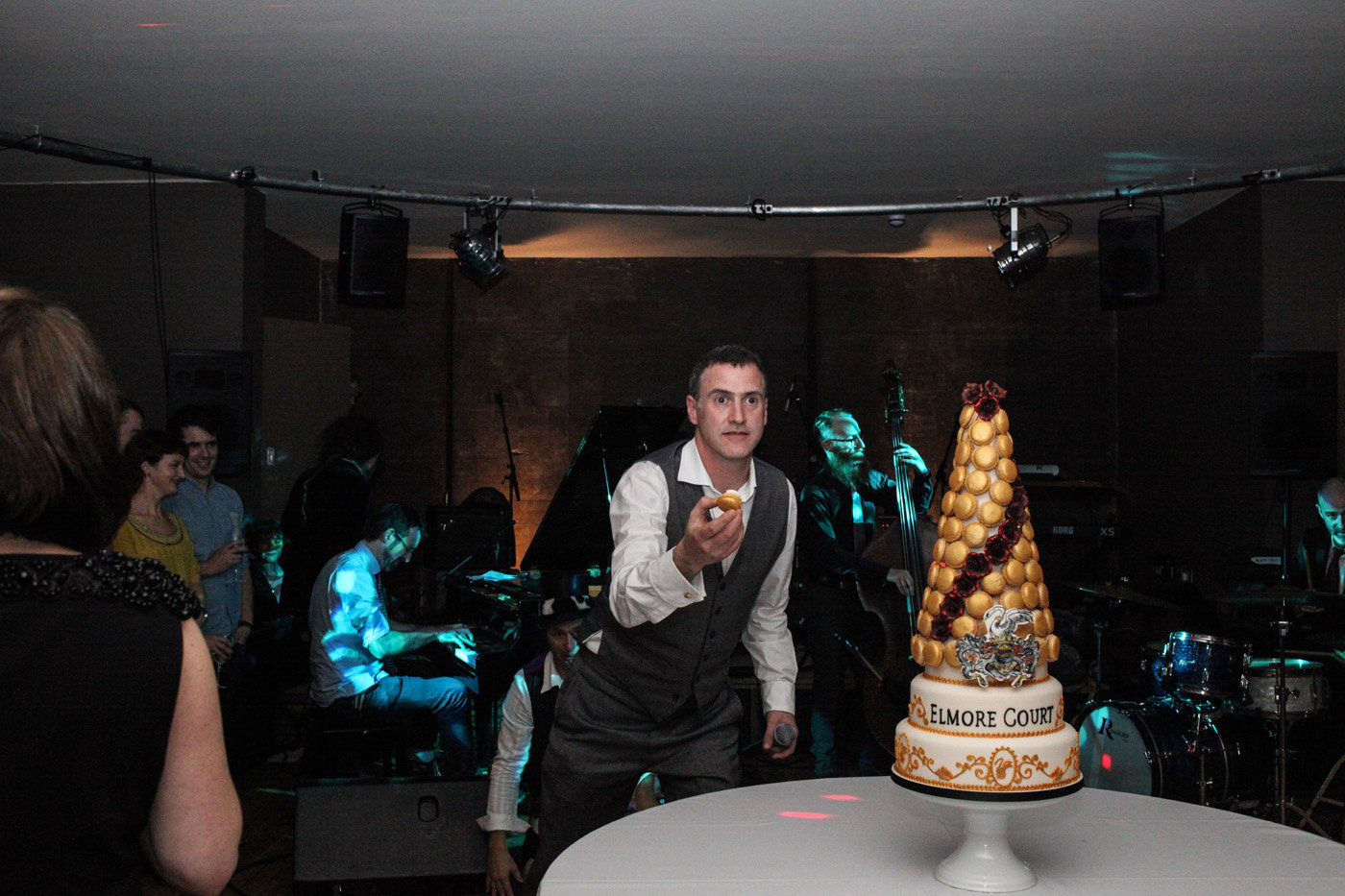 Anselm Guise eats first macaroon off huge cake at massive party for the launch of his wedding venue in 2013