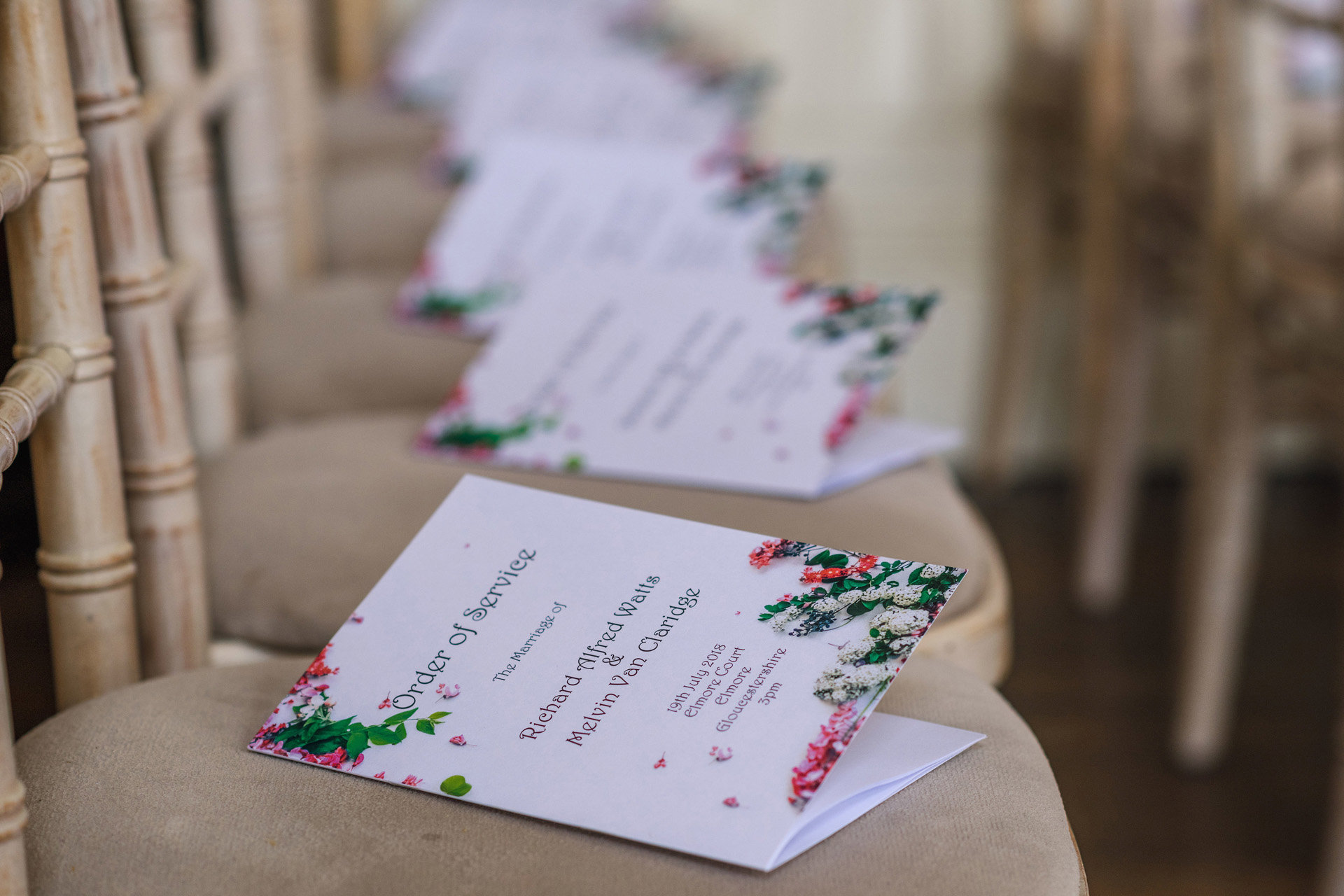 Floral wedding order of the day cards were DIY designed by the grooms