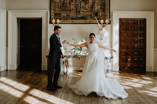 Luxe wedding couple dance alone in the hall at stately home elmore court