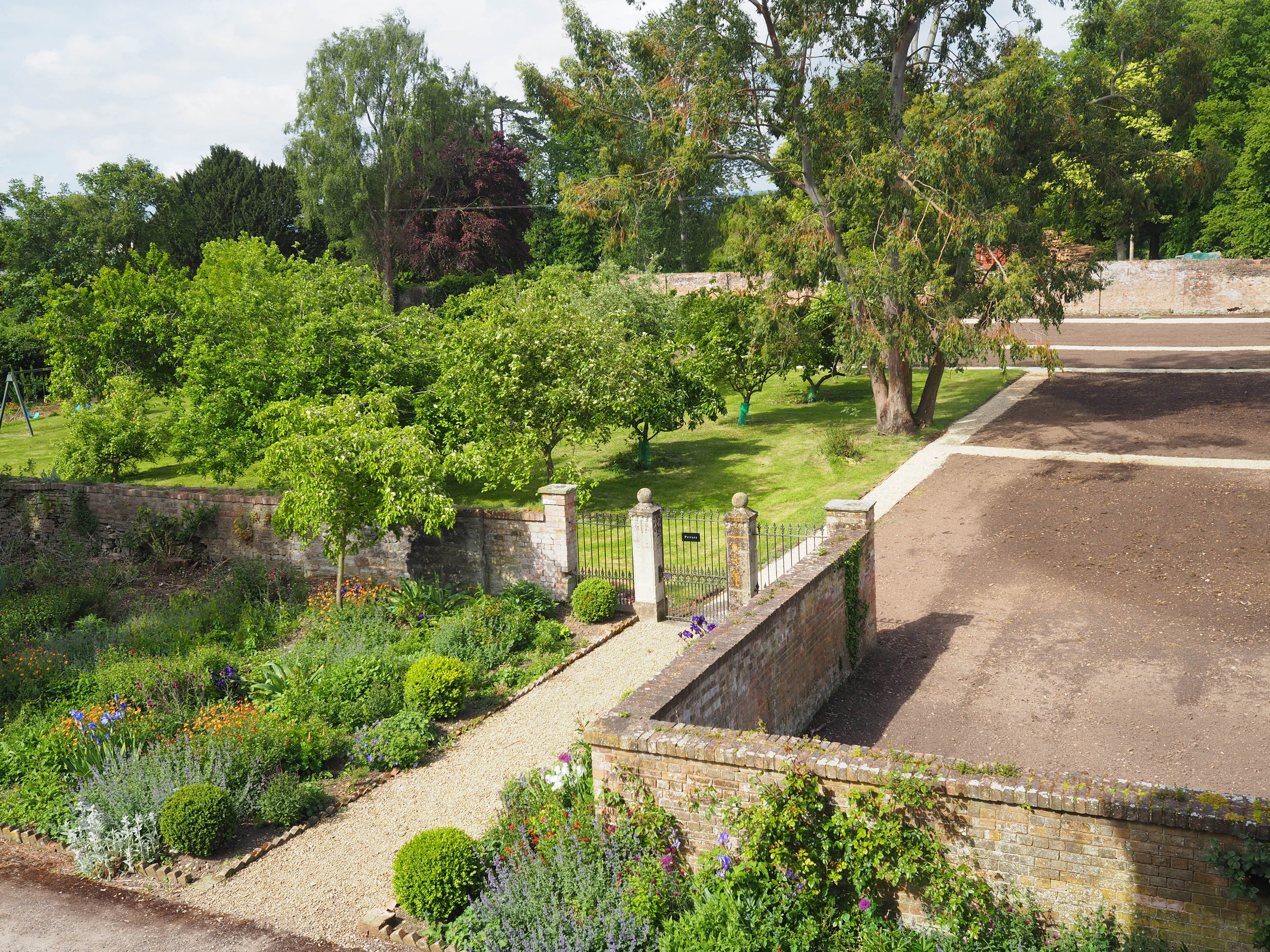 Walled garden at Elmore Court being renovated to produce more sustainable food for wedding menus at this eco friendly wedding venue in Gloucestershire