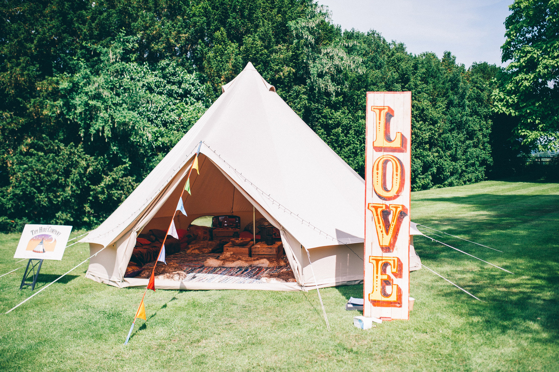 Festival wedding inspiration bell tent and love sign outdoors at elmore court 2021 and 22 weddings