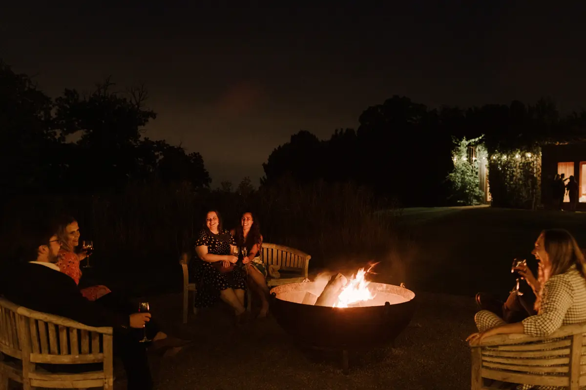Wedding venue with firepit and real fires for guests to sit around at night in the cotswolds countryside