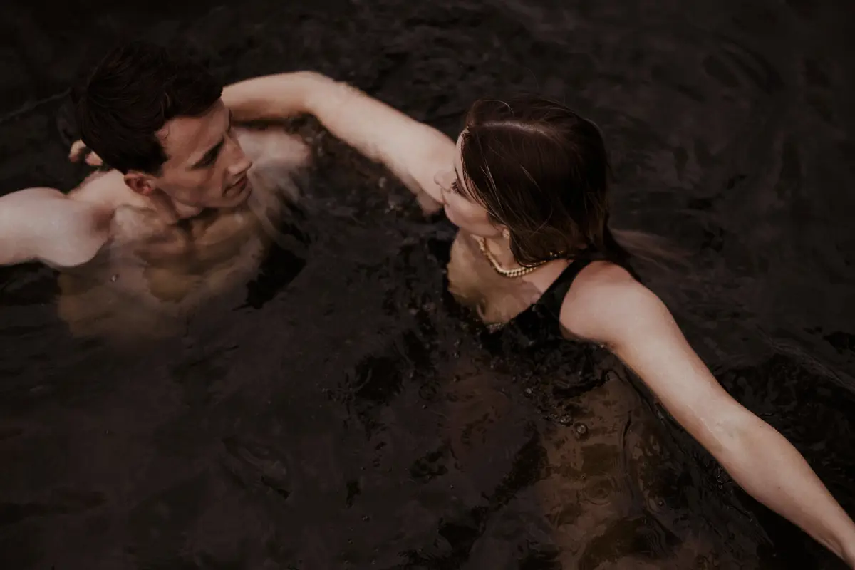 Wild wedding swimming sessions in the lake at rewilding venue in england
