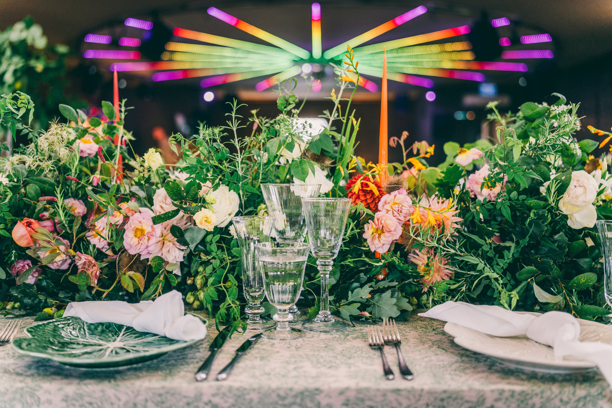 Soundproof Party wedding venue with cool lighting decorated with beautiful bright florals for Harvestival wedding fair