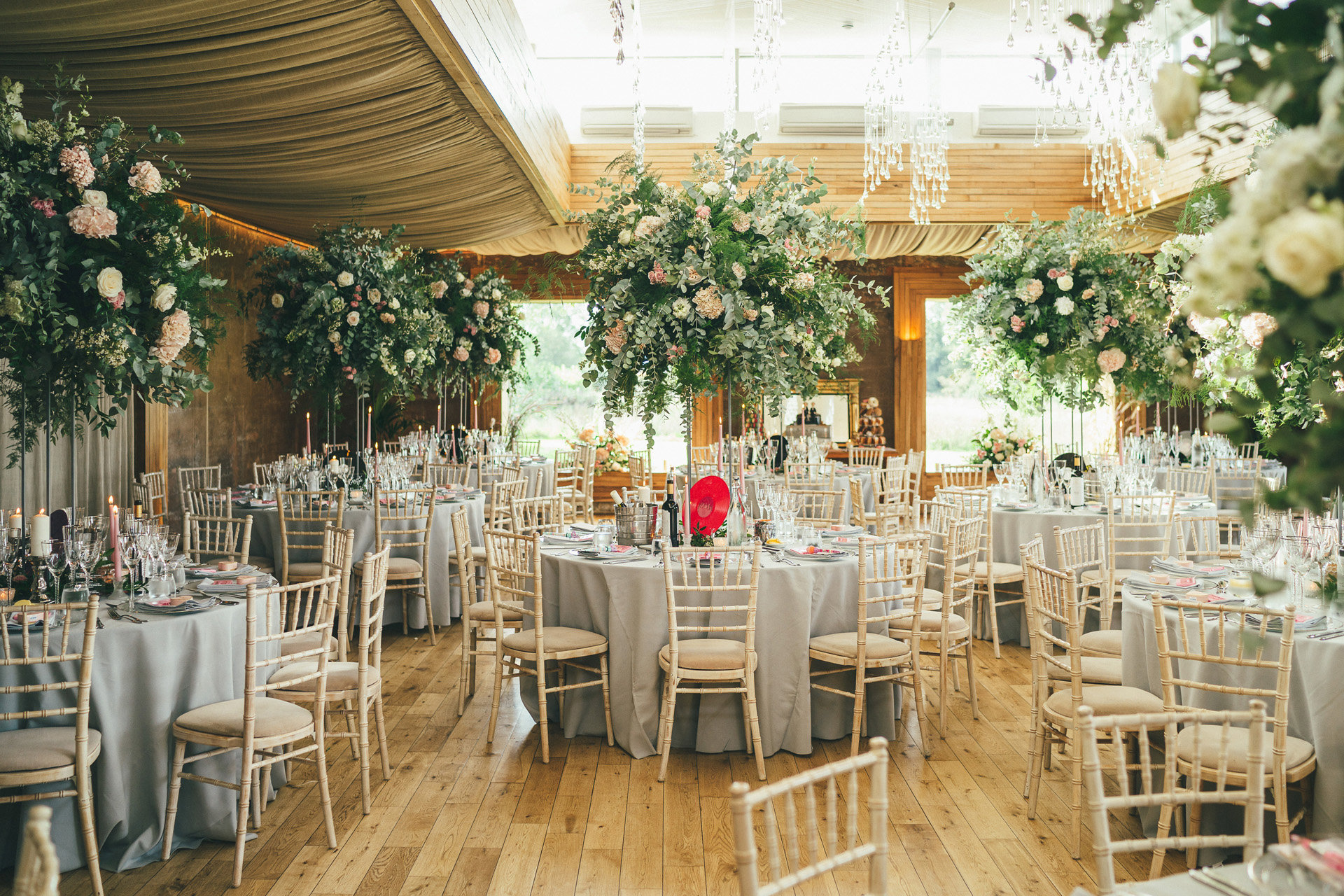 Romantic wedding reception ideas with roses on round tables