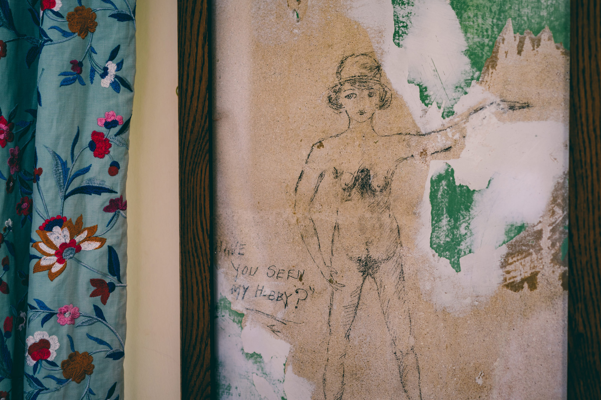 Ancient graffiti of a nude woman found in one of the bedrooms underneath the wallpaper of a stately home wedding venue